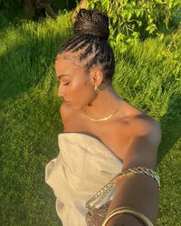 Photo by Megan Ria on May 23, 2024. May be an image of 1 person, braids and makeup..jpg