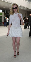 Elle-Fanning-in-White-Dress-at-Nice-Airport--05.jpg